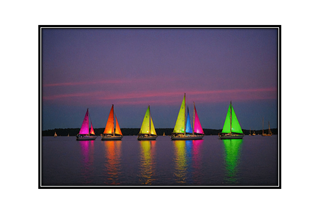 colorful sailboats at twilight