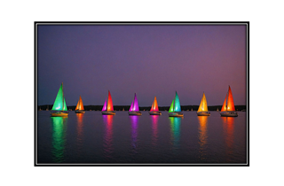 colorful sailboats at twilight