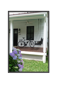 porch with bike and swing bench